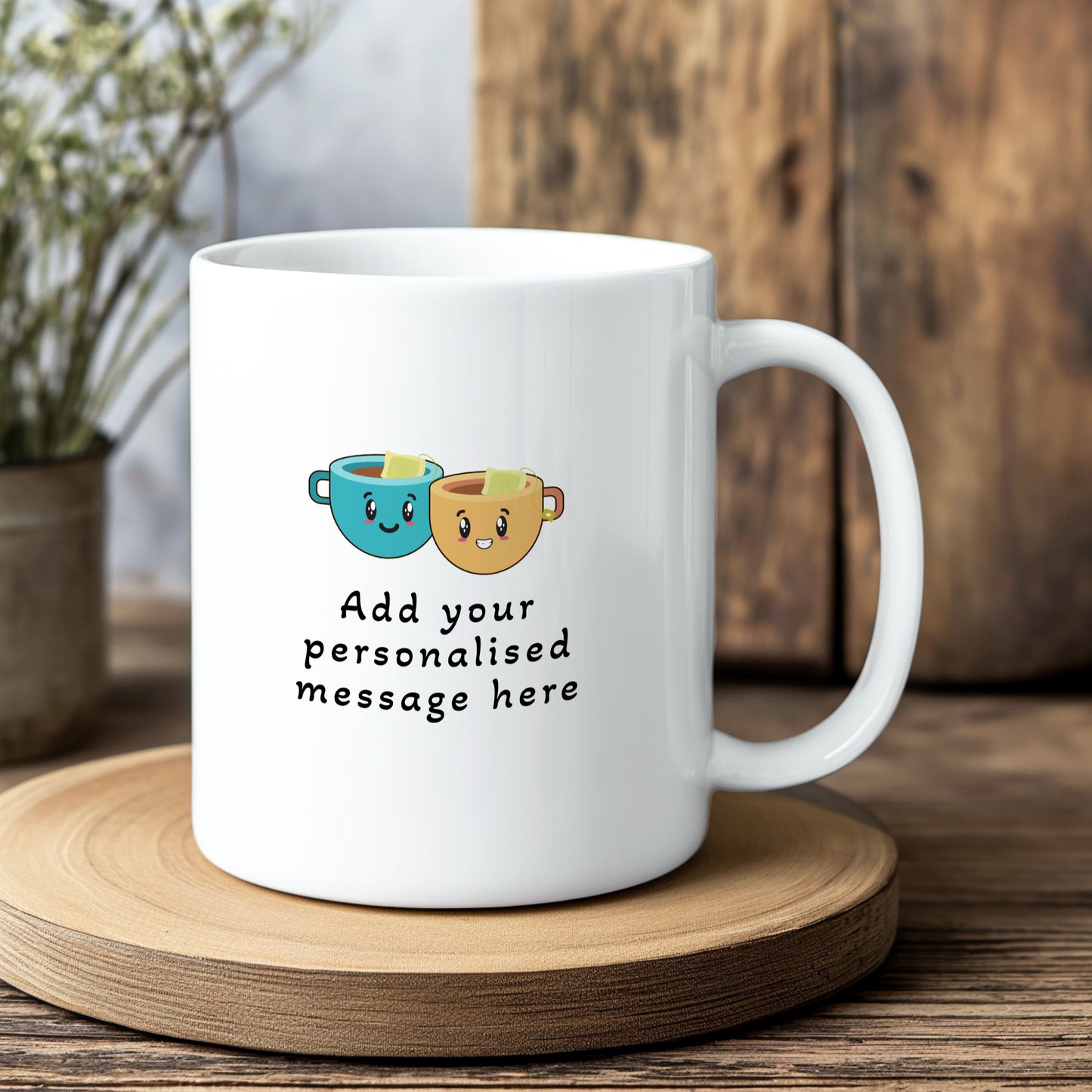 White mug with cartoon cups and text 'Add your personalised message here' on a wooden coaster.