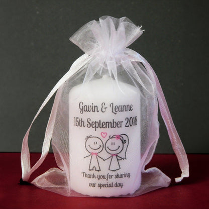 Personalized candle in a sheer bag with text and graphics on a dark background