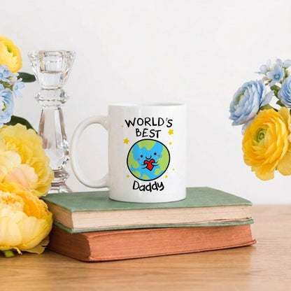 Mug with 'World's Best Daddy' design on a book with flowers and a candle in the background