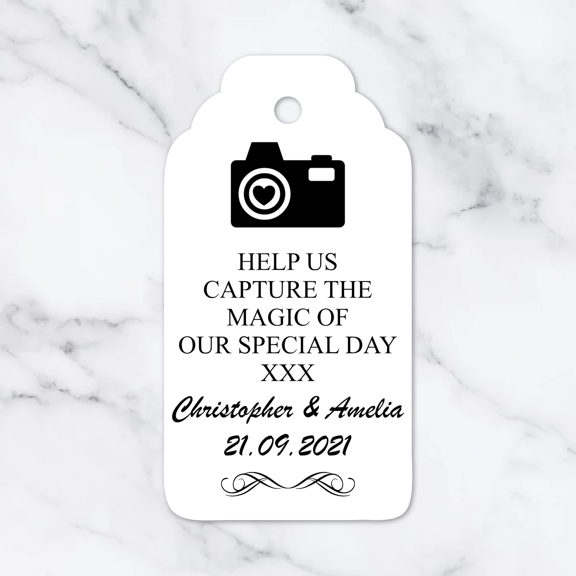 White tag with black text and camera icon on a marble background