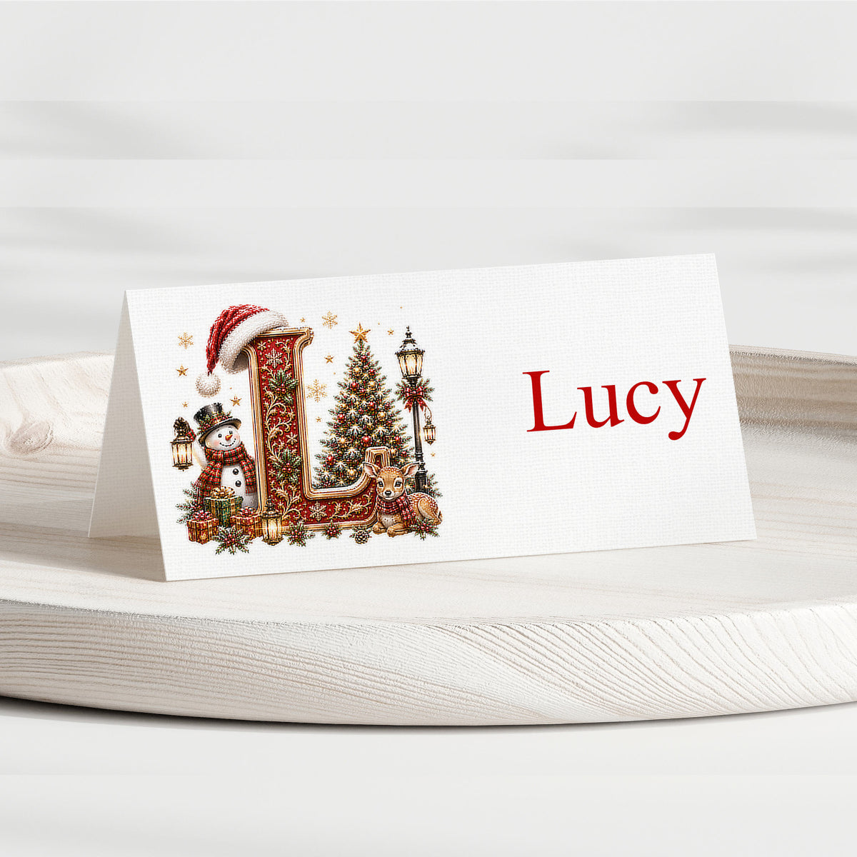 Personalised Christmas alphabet place card with illustrated L initial and name Lucy