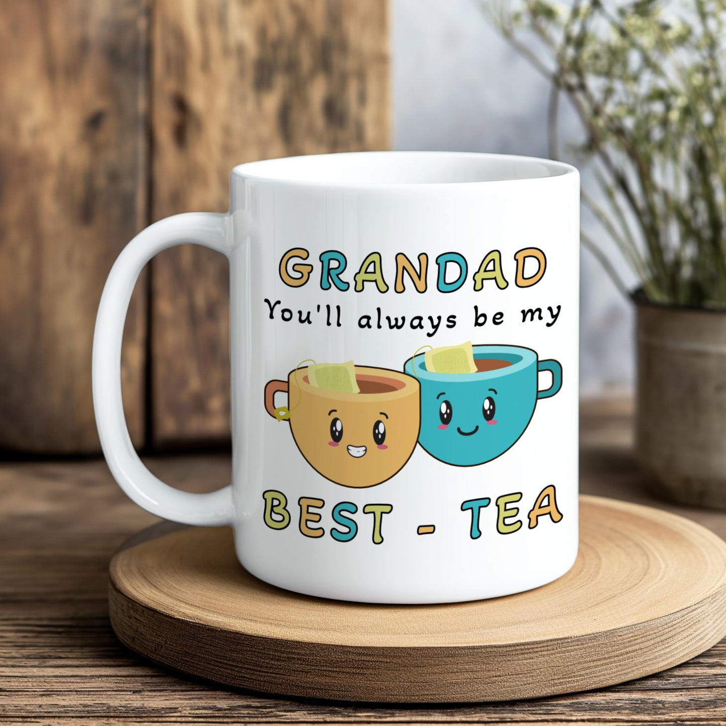 White mug with cartoon tea cups and text on a wooden coaster