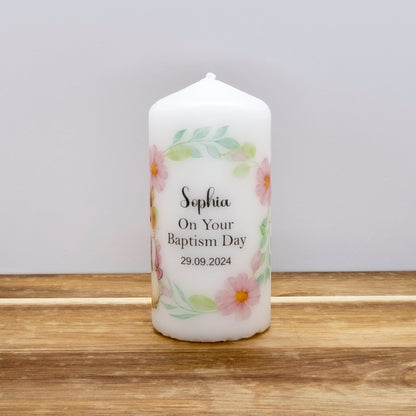 A white personalised taper candle with a floral border and the text 'Sophia On Your Baptism Day 29.09.
