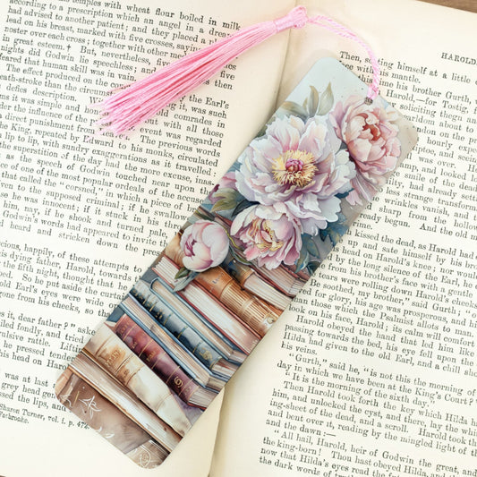 Floral bookmark on an open book with a pink tassel