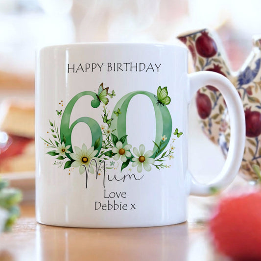 White mug with floral design and text on a blurred background