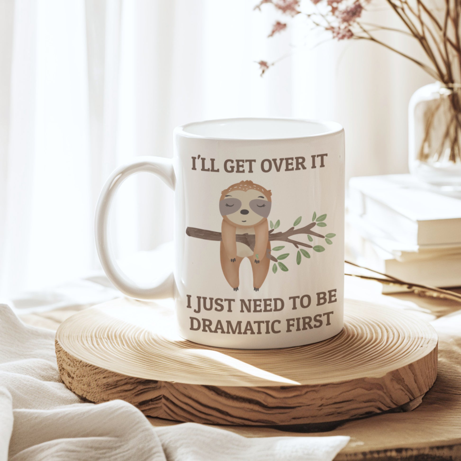 Mug with sloth illustration and text on a wooden coaster