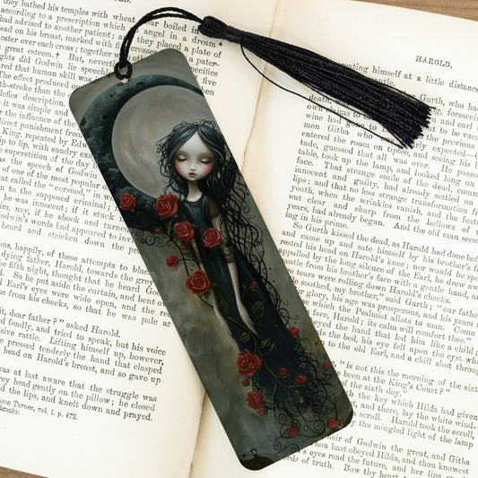 Artistic bookmark with a gothic design featuring a woman and roses on an open book.