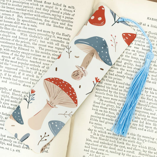 Bookmark with mushroom design on an open book