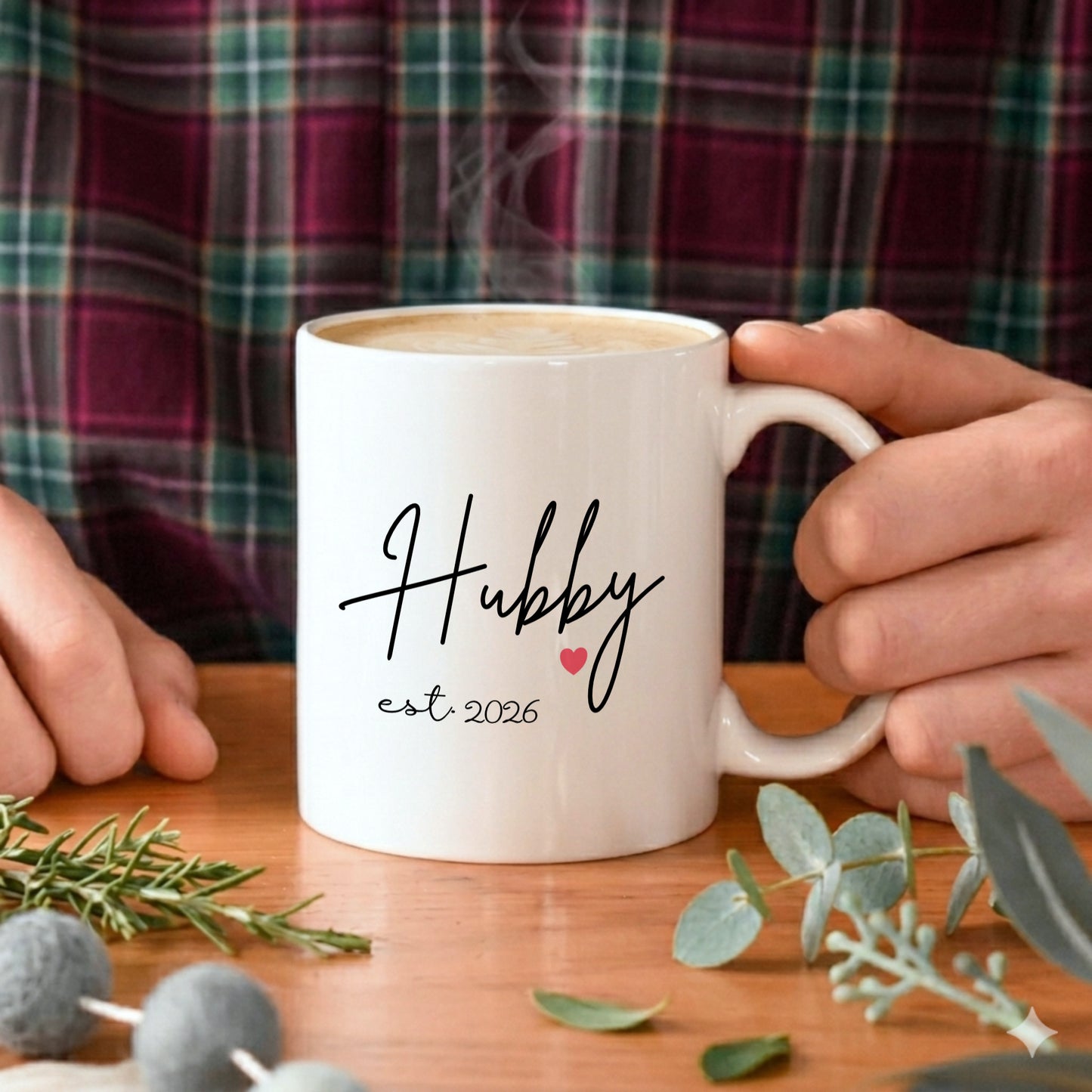 A man holding a white mug with the text Hubby on it
