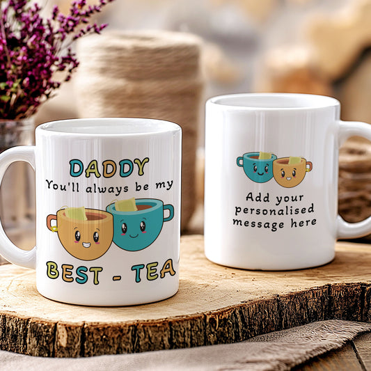 Two mugs with tea-themed designs on a wooden surface.