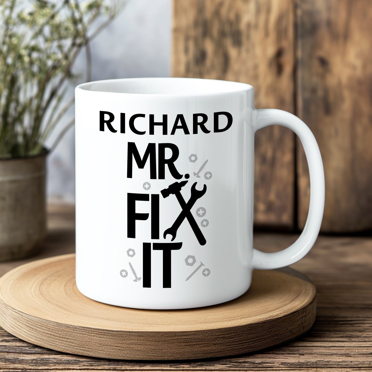 White mug with 'Richard Mr. Fix It' text on a wooden coaster