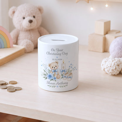A white ceramic christening money box with a printed teddy bear illustration and the text 'On Your Christening Day 15.11.