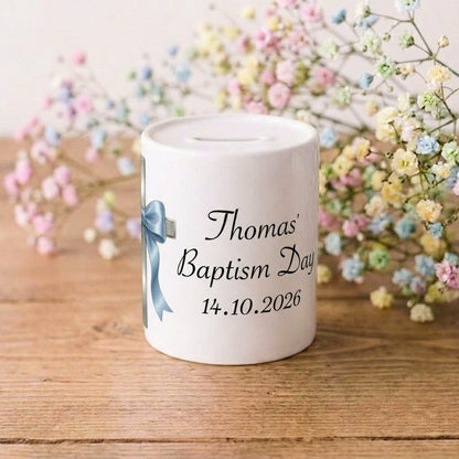 A white ceramic baptism day money box with personalised text reading 'Thomas' Baptism Day 14.10.