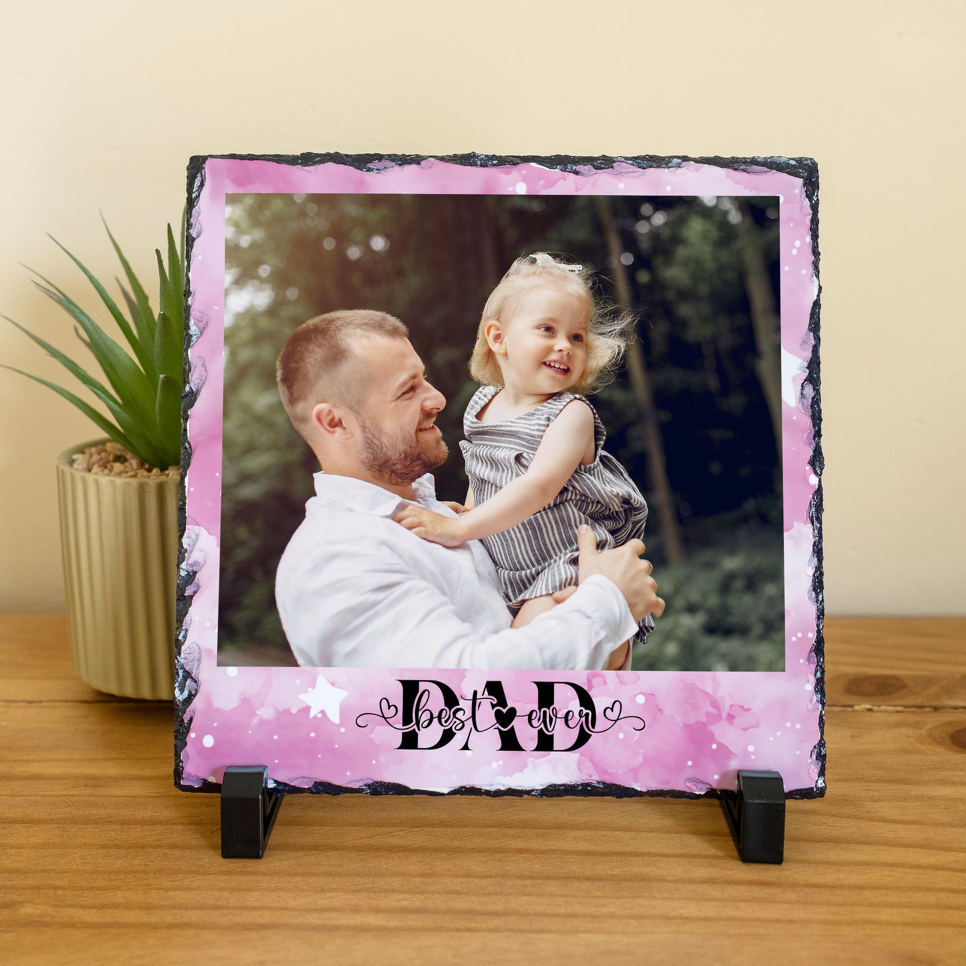 Personalised Best Ever Dad photo slate with pink watercolour background, showing a dad holding his daughter, with two black display stands