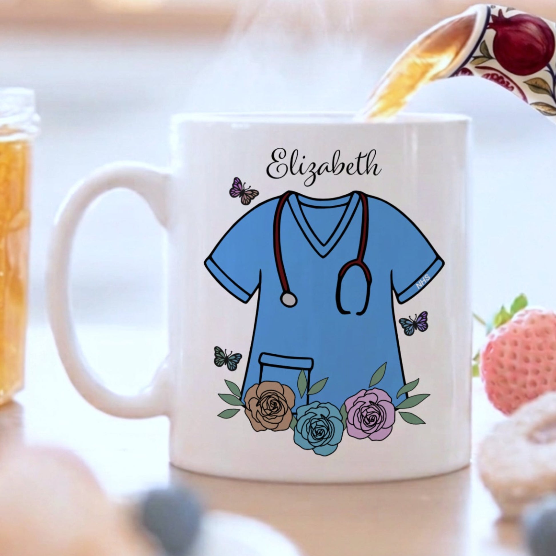 Mug with a medical scrub design and 'Elizabeth' text, surrounded by a breakfast setting.