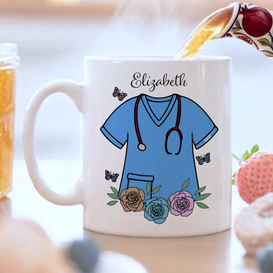 Mug with a medical scrub design and 'Elizabeth' text, surrounded by a breakfast setting.