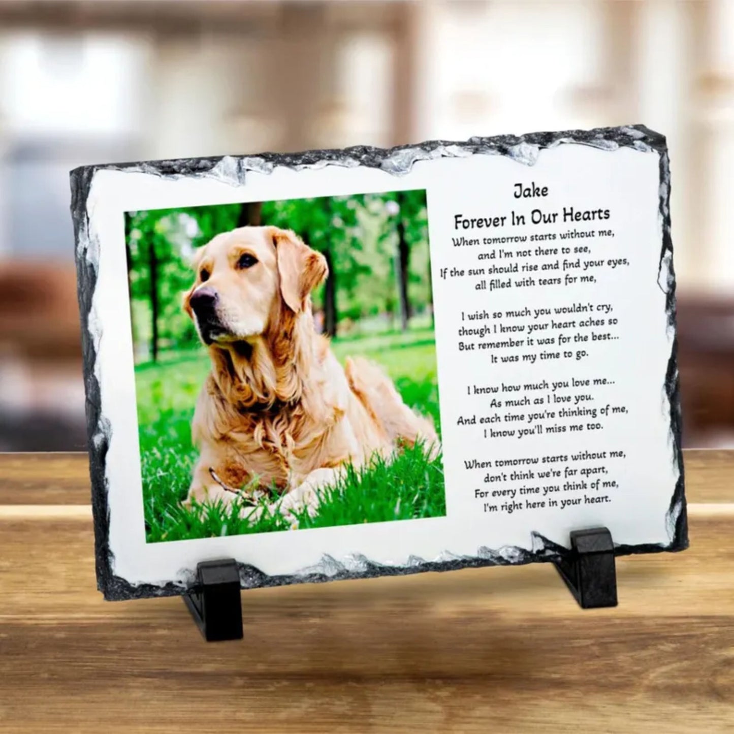 Personalised memorial slate plaque on a wooden stand, featuring a photo of a golden retriever and a printed remembrance poem titled 'Jake Forever In Our Hearts'.