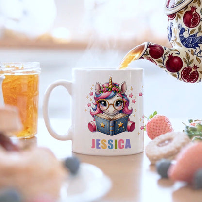 Mug with a unicorn design and 'Jessica' text, being filled with tea.