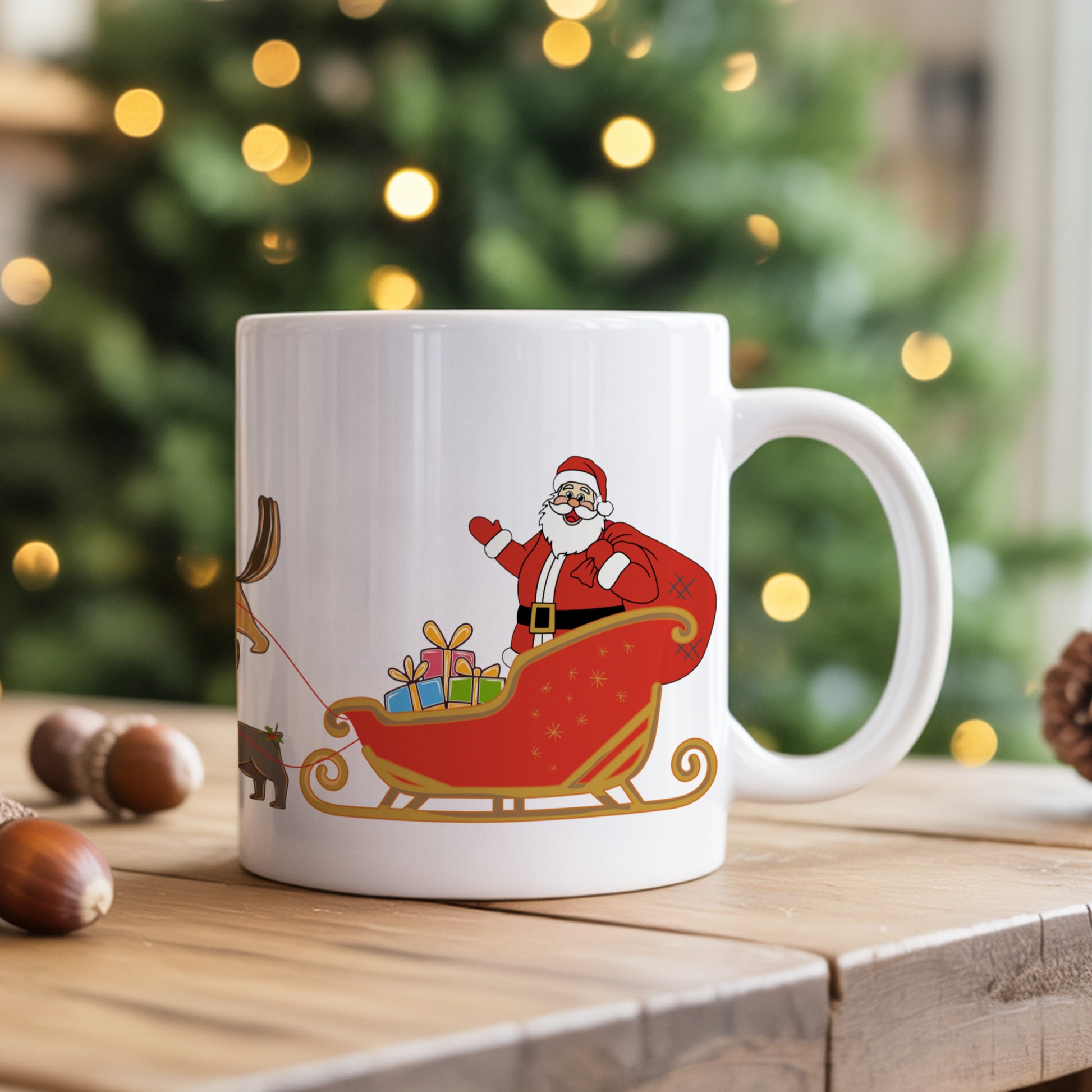 White mug with Santa Claus design on a wooden surface with a blurred Christmas tree in the background.