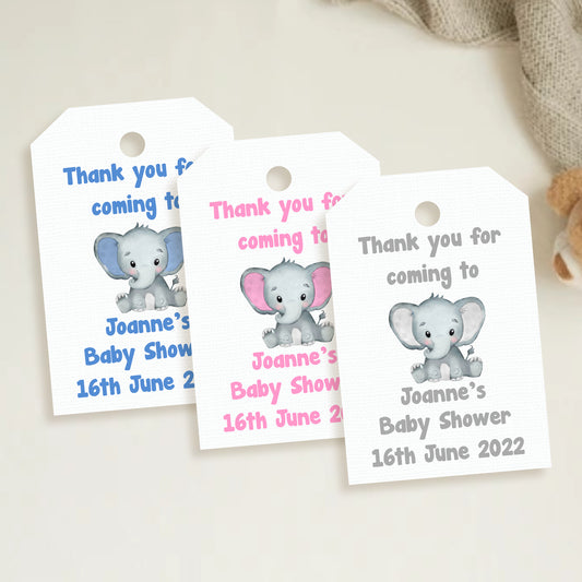 A set of three personalized elephant baby shower thank you tags with different colors and names customized for a baby shower event.