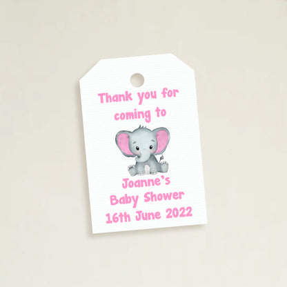 A set of three personalized elephant baby shower thank you tags with different colors and names customized for a baby shower event.