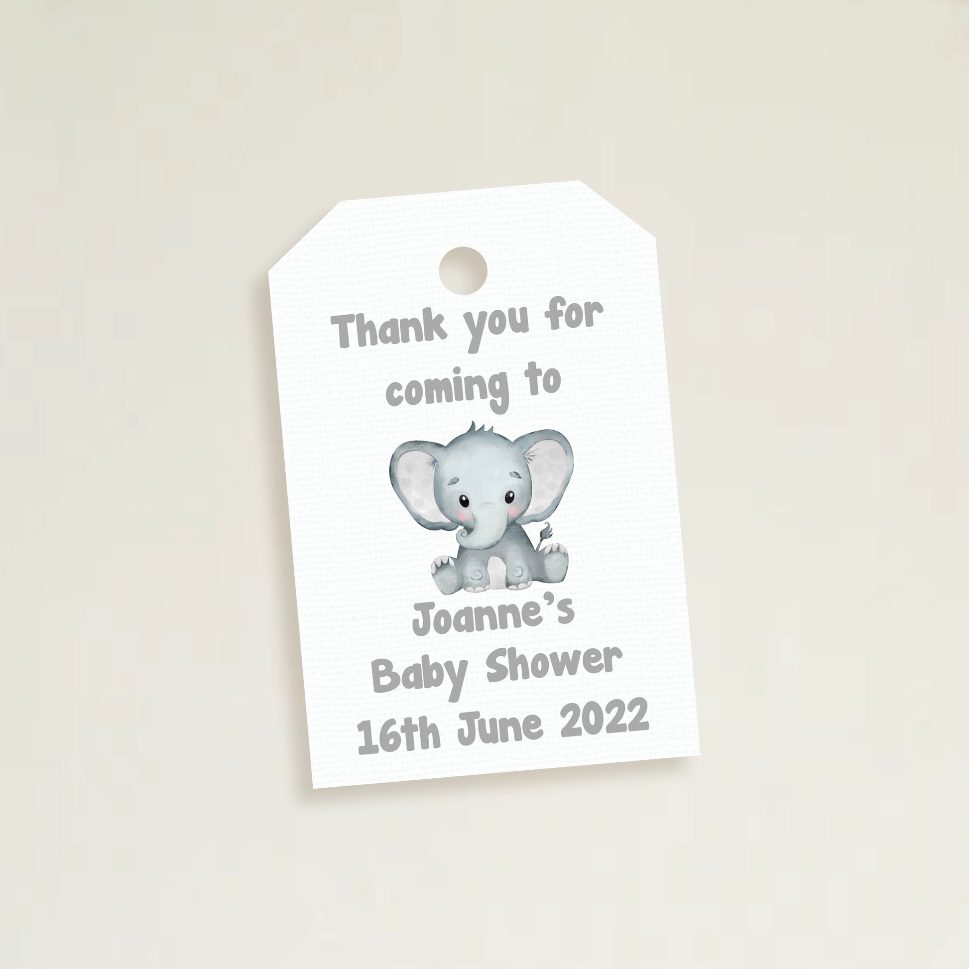 A set of three personalized elephant baby shower thank you tags with different colors and names customized for a baby shower event.