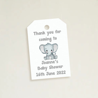 A set of three personalized elephant baby shower thank you tags with different colors and names customized for a baby shower event.