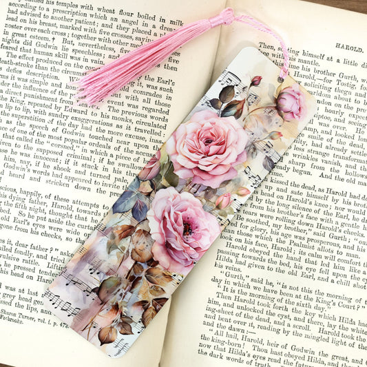 Floral and music sheet design bookmark on an open book