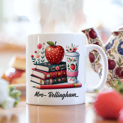 Personalised teacher mug with colourful stacked books and red apple design, customised with a teacher's name